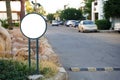 Round billboard template empty on city street. Place for advertising.