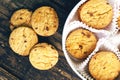 Round biscuits in a round box on a wooden background