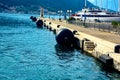 Round black buoys for mooring the vessel on the pier