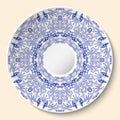 Round blue floral ornament. Styling based on Chinese or Russian porcelain painting. Pattern is applied to ceramic decorative plate Royalty Free Stock Photo