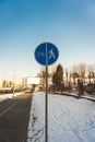 Round blue sign Pedestrian and Bicycle path close-up. A sign that divides the path for pedestrians and bicyclists. Royalty Free Stock Photo