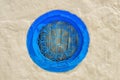 Round blue window and bar with arabic pattern . Wall of a house in Sidi Bou Said, Tunisia Royalty Free Stock Photo