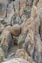 A round boulder suspended between rocks in the Alabama Hills near Lone Pine, California, USA Royalty Free Stock Photo