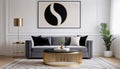 Round brass coffee table near black sofa against white wall with big monochromatic pattern art poster frame. Art Deco style home Royalty Free Stock Photo