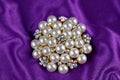 Round brooch with pearls