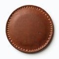 Round brown leather patch with stitching isolated white background. Circle shape textile texture. Vintage style hand-made design, Royalty Free Stock Photo