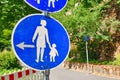 Round bue pedestrian path road sign showing woman and child Royalty Free Stock Photo