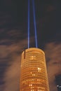 Round building with two spotlights at night Royalty Free Stock Photo