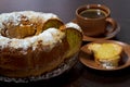 Round cake with sugar top and coffee