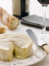 Round of camembert cheese with French stick Royalty Free Stock Photo