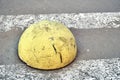 Round car parking barrier on zebra crossing