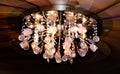 Round chandelier on an abstract stretch ceiling