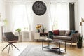 Round chandelier in a retro living room interior