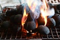 Smoking and burning barbeque coal Royalty Free Stock Photo