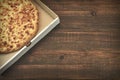 Round Cheese Pie Or Quatrro Formaggi Pizza On Brown Table