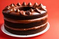 Round chocolate cake with cream and chocolate shavings