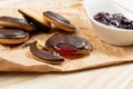 Round chocolate jaffa cake or biscuit cookie filled with natural jam Royalty Free Stock Photo