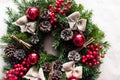 Round Christmas wreath with red baubles and berries Royalty Free Stock Photo