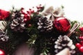 Round Christmas wreath with red baubles and berries Royalty Free Stock Photo