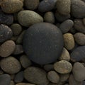 Round circle shape of big sea stone laid on a pile of nature pebbles or a group of rocks.