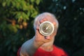 Round classic compass in hands of man
