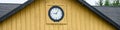 Round clock on the exterior of a building, time for change, fresh starts, or other concepts