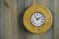 Round clock from Karelian birch Royalty Free Stock Photo