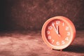 Round clock showing time five minutes to twelve with copy space Royalty Free Stock Photo