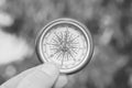 Round compass on natural background