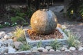 Water fountain in garden at sunset Royalty Free Stock Photo