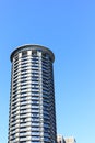 Round condo Tower Rising into Blue Sky Royalty Free Stock Photo