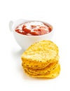Round corn nacho chips and tomato dip. Yellow tortilla chips and salsa Royalty Free Stock Photo
