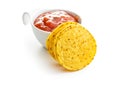 Round corn nacho chips and tomato dip. Yellow tortilla chips and salsa Royalty Free Stock Photo