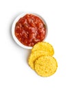 Round corn nacho chips and tomato dip. Yellow tortilla chips and salsa Royalty Free Stock Photo