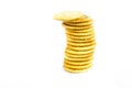 Round crackers in stacked trying not fall over Royalty Free Stock Photo