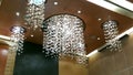 Round Crystal chandelier hanging from ceiling of a hall Royalty Free Stock Photo