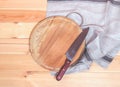 Round cutting board, kitchen knife and towel Royalty Free Stock Photo