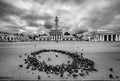 A round dance of pigeons on the square of the old town of Kostroma. Russia. black and white