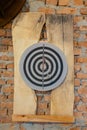 Round dart board hanging on a brick wall Royalty Free Stock Photo