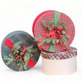 Round decorated box with colored ribbon-