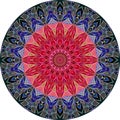 Round decorative plate with a flower - mandala with center in crimson and edge in blue colors Royalty Free Stock Photo