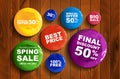 Round discount banners paint on wooden background