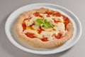 Round dish with classic pizza of Naples