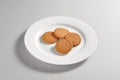 Round dish with 4 shortbread biscuits Royalty Free Stock Photo