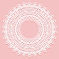 Round doily on a pink background. Openwork lace ornament for frame design