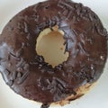 The round donuts with chocolate topping and sprinkled chocolate taste sweet and delicious