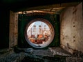 Round door or gate to abandoned nuclear rector or generator room in ruined and destroyed Crimean Nuclear Power Plant