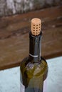 Wine bottle and blurry shabby wooden backdrop Royalty Free Stock Photo