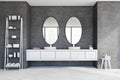 Round double sink in grey bathroom, oval mirrors