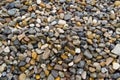 Round and edgy gravel stones on the beach